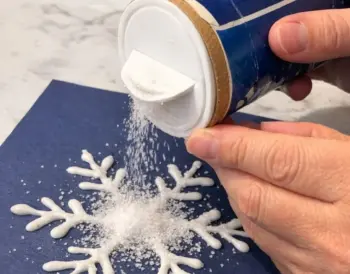 Pour table salt over glue doodles, and the end result is magical