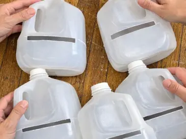 Stack empty plastic milk jugs and slice them this strange way, and the transformation has neighbors stopping to stare