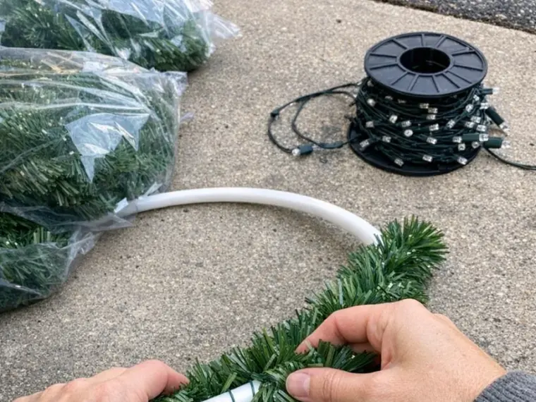 Wrap a hula hoop in dollar store garland, and the end result is spectacular